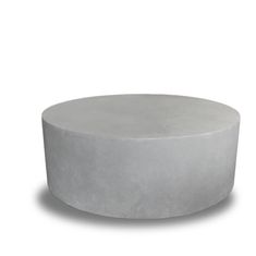 a round concrete table on a white background