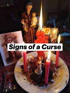 a cake with candles and pictures on the table in front of it that says signs of a curse