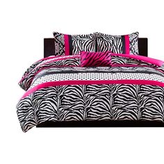 a zebra print comforter set with pink trimmings on the bottom and sides