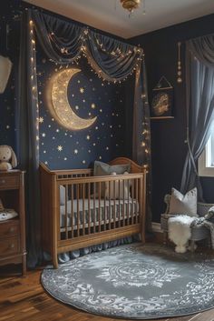 a baby's room decorated in blue and gold with stars on the ceiling, crib