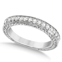 a white gold wedding band with round cut diamonds