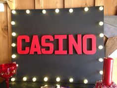 a casino sign with lights around it