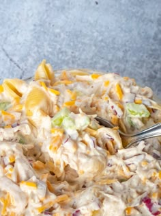 a bowl filled with pasta salad on top of a table