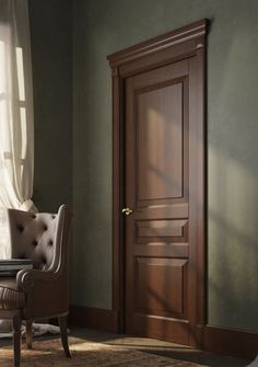 a chair sitting in front of a wooden door