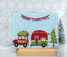 a christmas card with a red truck and green trailer in front of a snowy background