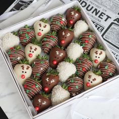 chocolate covered strawberries are arranged in a box