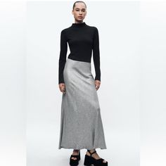 New With Tag Long Skirt Made Of Viscose And 10% Wool Blend Fabric. Mid Waist. Shiny Fabric Detail. A-Line Silhouette. Side Hidden In-Seam Zip Closure. Approximate Measurement Laying Flat Large Waist 16” Length 39” Xlarge Waist 17.5” Length 40.5” Outer Shell 75% Viscose 10% Wool 10% Polvester Metallised Fibre 5% Polyamide Silver Color 863 Relaxed Viscose Skirt For Fall, Fall Midi Skirt In Viscose, Fall Viscose Midi Skirt, Zara Relaxed Fit Maxi Skirt For Fall, Zara Maxi Skirt For Fall, Zara Fall Maxi Skirt, Elegant Zara Maxi Skirt In Relaxed Fit, Chic Zara Maxi Skirt For Fall, Zara Long Maxi Skirt For Party