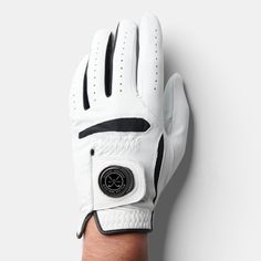 a person's hand wearing a white glove with black trimmings on it