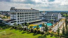 an aerial view of a hotel with a swimming pool