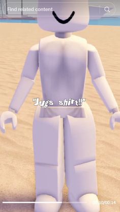 a white robot standing on top of a sandy beach