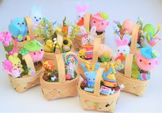 a group of small baskets filled with stuffed animals