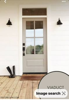 a white front door with two black boots on the porch and an image search button