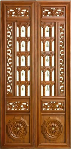 an intricate wooden door with carvings on it