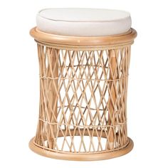 the stool is made out of bamboo and has a white cushion on top of it