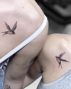 two birds on the back of each other