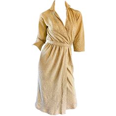 Sexy and iconic 70s HALSTON gold metallic silk lurex wrap shirt dress! Features a stunning silhouette, with a plunging neckline in a flattering wrap style. Studio 54 at its' finest! Couture detail, with heavy attention to detail. Roy Halston was known for creating frocks that really flatter a woman's figure--this piece is a prime example of his expert craftmanship. Hook-and-eye closure at side waist, with an additional hook-and-eye at interior opposite side waist. Great for any day or evening ev Halston 1970s, Roy Halston, Brown Evening Dresses, Halston Vintage, Halston Dress, Wrap Shirt Dress, Vintage Disco, 70s Maxi Dress, Chiffon Wrap