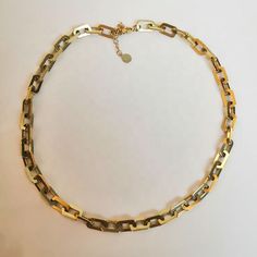 Introducing our stunning Chain Gang Necklace! This piece is the perfect addition to any jewelry collection. Made with 18k gold plated stainless steel, it's both beautiful and durable. The classic link chain design is timeless and versatile, making it perfect for any occasion. The Chain Gang Necklace has a length of 15" with a 2" extender, allowing you to adjust the length to your desired fit. You can wear it as a choker or let it hang as a longer necklace. The extender ensures that it fits perfe Gold Stainless Steel Jewelry With Rectangular Links, Gold Stainless Steel Jewelry With Paperclip Chain, Oval Link Stainless Steel Chain Necklace As Gift, Stainless Steel Necklace With Rectangular Links For Gifts, Stainless Steel Oval Link Chain Necklace As Gift, Gold Stainless Steel Chunky Chain Necklace, Classic Stainless Steel Necklace With Chunky Chain, Classic Stainless Steel Necklace With Gold Chain, Gift Stainless Steel Oval Link Chain Necklace