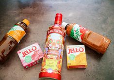 several different types of condiments are on the floor next to bottles and packets