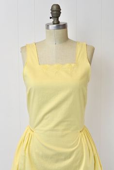 Yellow Vintage Fashion Dress, Yellow 1950s Sleeveless Dress, Yellow 1950s Style Sleeveless Dress, Yellow Sleeveless 1950s Dress, Yellow Vintage Summer Dress For Daywear, Classic Sleeveless Vintage Summer Dress, Classic Sleeveless Summer Vintage Dress, Yellow Vintage Dress For Summer Daywear, Mid-century Yellow Dresses For Spring