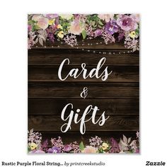 a wooden sign that says cards and gifts with purple flowers on the bottom right corner