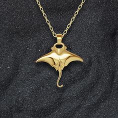 Gold Manta Ray charm pendant and chain. Please allow me up to 30 days to finish making this piece. An elegant little, double sided, solid gold version of one of my best loved pieces. Designed to complement more refined outfits, from garden party dresses to sophisticated eveningwear. This piece is made from .375 nine carat gold and is supplied on a 45cm (18 inch) long, 1.2mm wide solid gold chain. This charm measures 1.8cm in wide, which is 0.71 inches. Eighteen or twenty two carat gold versions of this necklaces can be made on request. Wearing a piece of Adrian Ashley’s jewellery identifies you as someone who can appreciate handmade goods and fine craftmanship. I do my best to insure all the raw materials I use have been sourced responsibly and I always price my work honestly. All pieces a Garden Party Dresses, Solid Gold Charms, Twenty Two, Garden Party Dress, Manta Ray, Charm Necklace Silver, Solid Gold Chains, Gold Charm Necklace, Gold Charm