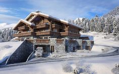 a large house in the middle of a snowy mountain area with trees on both sides