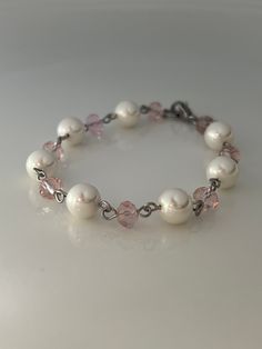 8mm White shell pearl and 5x6 pale pink crystal glass beads, silver stainless steel with a small lobster claw closure. Available in 6" and 7 inches.  Hand made jewelry!  All purchase will arrive in gift boxes  Thanks for stopping by! Pearl Bracelet Ideas Diy, Elegant Pink Crystal And Pearl Bracelet, Elegant Pink Pearl Crystal Bracelet, Pink Pearl Jewelry With 8mm Beads, Elegant Pink Pearl Bracelet With 8mm Beads, Adjustable Pink Pearl Bracelet With Pearl Drop, Pink Pearl Drop Bracelet, Elegant Pink Hypoallergenic Beaded Bracelets, Pink And White Bracelet