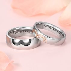 two wedding rings with the words forever and always engraved on them, sitting next to each other