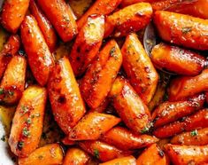 cooked carrots with herbs and seasoning in a pan