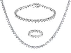 Bella Luce® white diamond simulant 28.56ctw heart, rhodium over sterling silver jewelry set. Ring Measures approximately 0.88" L x 0.13" W and is not sizeable. Tennis Necklace measures approximately 18.00" L x 0.13" W and has a box clasp. Tennis bracelet measures approximately 7.25-8" L x 0.13" W and has a hidden box clasp. The diamond equivalent weight is 17.30ctw. Heart Cut Crystal Jewelry With Diamond Accents, Formal Heart Cut Crystal Jewelry, Diamond White Heart-cut Jewelry For Formal Events, Formal Heart-shaped Diamond White Jewelry, Formal Heart Shaped Diamond White Jewelry, Formal Diamond White Heart Cut Jewelry, Formal Diamond White Heart Jewelry, Classic Cubic Zirconia Jewelry For Valentine's Day, Cubic Zirconia Jewelry With Prong Setting For Valentine's Day