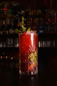 a red drink sitting on top of a table