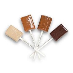 four different types of caramel and chocolate on sticks