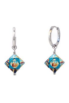 a pair of earrings with an image of a building on the front and back side