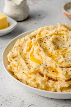 mashed potatoes in a bowl with butter and seasoning