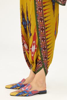 Pickle satin dhoti pant with geometric print
Components: 1
Pattern: Printed
Type Of Work: Geometric
Fabric: Satin
Color: Yellow
Other Details: 
Elasticated back
Note: Top worn by the model is not for sale
Occasion: Puja - Aza Fashions Traditional Block Print Bottoms For Summer, Traditional Pants With Printed Motifs For Festivals, Traditional Multicolor Harem Pants With Elastic Waistband, Traditional Multicolor Festive Bottoms, Traditional Festive Multicolor Bottoms, Festive Traditional Multicolor Bottoms, Traditional Multicolor Festive Pants, Traditional Block Print Pants, Traditional Bottoms With Printed Motifs For Eid