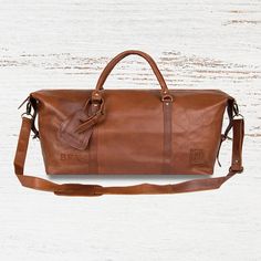 Hit the high seas or the boot of your car with our Armada Duffle in our flagship Vintage Brown Leather, inspired by the 16th-century Spanish sailing fleet. Shaped like a ships hull, this sturdy duffle bag comes complete with complimentary luggage tag and a hard base to protect its Leather Overnight Bag, Leather Holdall, Golf Gifts For Men, Overnight Bags, Leather Bags Handmade, Gifts For Brother, Gorgeous Bags, Grandpa Gifts, Overnight Bag