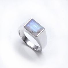 RING DETAIL Metal : 925 sterling silver Center stone : Rainbow Moonstone Size of stone : 9x12 mm Shape : Rectangle About gemstone-Rainbow moonstone is related with different Moon Goddesses .Moonstone has a solid association with the otherworldly world. It has incredible supporting energy which will give simplicity and guide in troublesome occasions particularly in issues identified with adoration and family. It helps in banishing our own cynicism It supports clear dreaming and helps our inner mi Natural Pearl Ring, Red Garnet Ring, June Birthstone Ring, London Blue Topaz Ring, Rainbow Moonstone Ring, Ring For Men, Blue Sapphire Rings, Art Deco Ring, Men's Ring