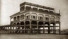 an old building with balconies on the roof