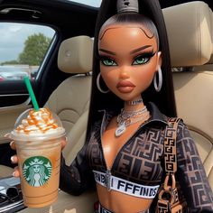 a barbie doll holding a starbucks drink in her hand