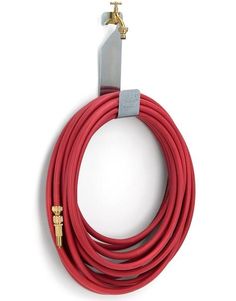 a red extension hose with brass fittings on an isolated white background for use in commercial purposes