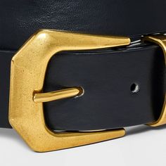 Enhance any of your looks with this Sculpted Metal Buckle Belt from Universal Thread™. This stylish belt with a medium-width profile features a sculpted gold metal buckle for unique, fashionable appeal. The adjustable strap with belt loops offers a secure, customized fit around your waist, and the black color pairs well with both casual and dressy outfits. Universal Thread™: Found exclusively at Target. Black Brass Buckle Belt For Workwear, Chic Formal Belts With Brass Buckle, Chic Formal Belt With Brass Buckle, Chic Black Belt Buckles With Brass Detail, Chic Black Belt Buckles With Brass Buckle, Chic Black Belt With Brass Buckle, Modern Gold Belt With Brass Buckle, Gold Belt With Brass Buckle For Work, Gold Rectangular Buckle For Formal Belt