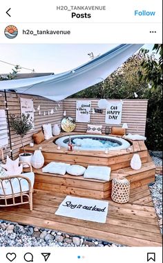 a hot tub sitting on top of a wooden deck