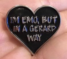 a heart shaped pin with the words i'm emo but in a gerard way