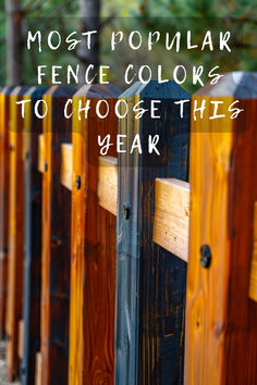 a row of wooden fence posts with the words most popular fence colors to choose this year