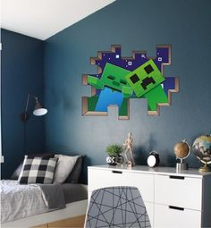 a room with a bed, dresser and wall decoration in the shape of a minecraft creeper