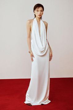 This luxurious dress is crafted from high-quality silk satin for a smooth and elegant look. The cowl neck adds a touch of sophistication while the straight cut and floor-length design flatters all body types. This dress is a timeless addition to any wardrobe, perfect for any formal occasion. Cowl Neck Dress White, High Cowl Neck Dress, Pre-draped Satin Maxi Dress With Cowl Back, Formal Pre-draped Maxi Dress With Cowl Back, Elegant Satin Cowl Neck Dress, Formal Draped Maxi Dress With Bias Cut, Bias Cut Draped Maxi Dress For Formal Occasions, Chic Formal Silk Dress With Cowl Back, Silk Cowl Neck Dress For Gala