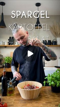 a man standing in front of a bowl filled with food