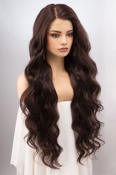 • Color: Brunette, Dark Chocolate • Texture: Wavy• Wig Type: Lace Front Wig• Length: About 32""• Cap Size: 21""-22.5""• Parting: 13"" X 4"" Lace Free Part• Material: Heat Resistant Fiber• Lace Type: Swiss Lace• Combs: 3 CombsExperience the ethereal allure of the Dark Chocolate Brunette Lace Front Wig. At a majestic 32" Dark Chocolate Brunette, Silver Blonde Ombre, Chocolate Brunette, Chocolate Texture, Blonde Ombre Balayage, Top Wig, Celebrity Wigs, Wig Lace Front, European Hair