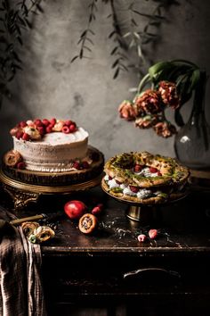 two cakes sitting next to each other on top of a table