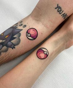 two people with matching tattoos on their legs, one has a pikachu and the other has a pokeball